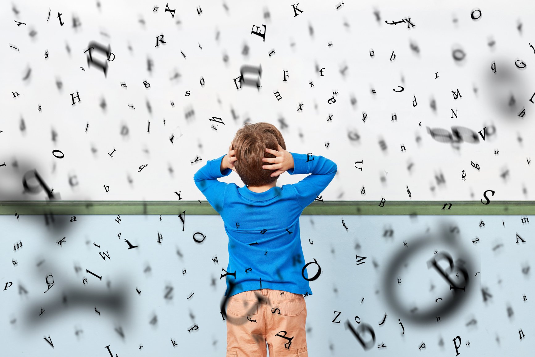 Child with Dyslexia in Front of Whiteboard in School